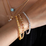 Lab-grown diamond tennis bracelet, adorned with four different diamond shapes.