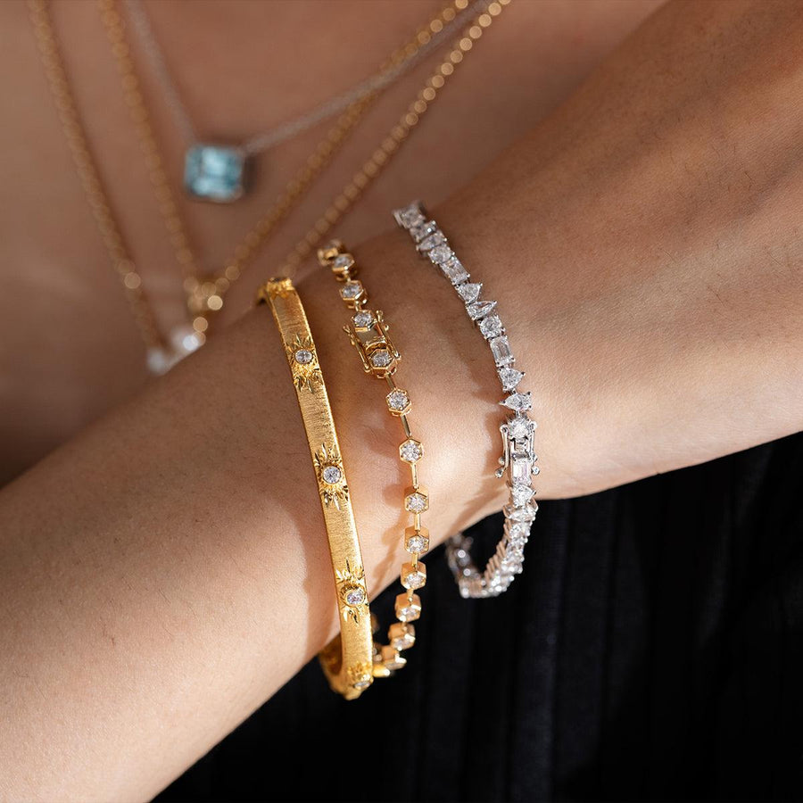 Lab-grown diamond tennis bracelet, adorned with four different diamond shapes.